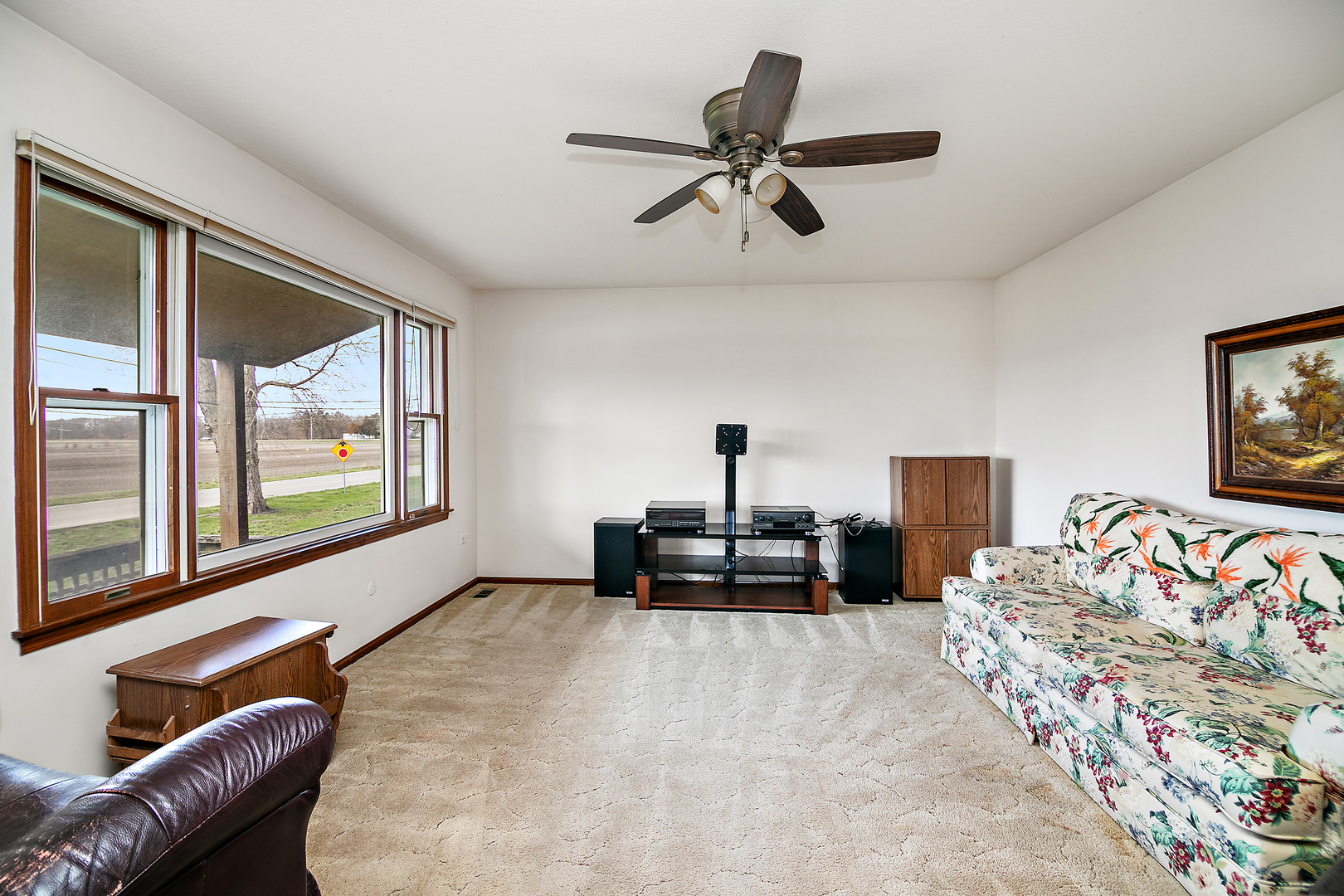 209 East Vanderkarr Road St. Anne, IL 60964 - Photo 5 of 23 a living room with furniture and a large window