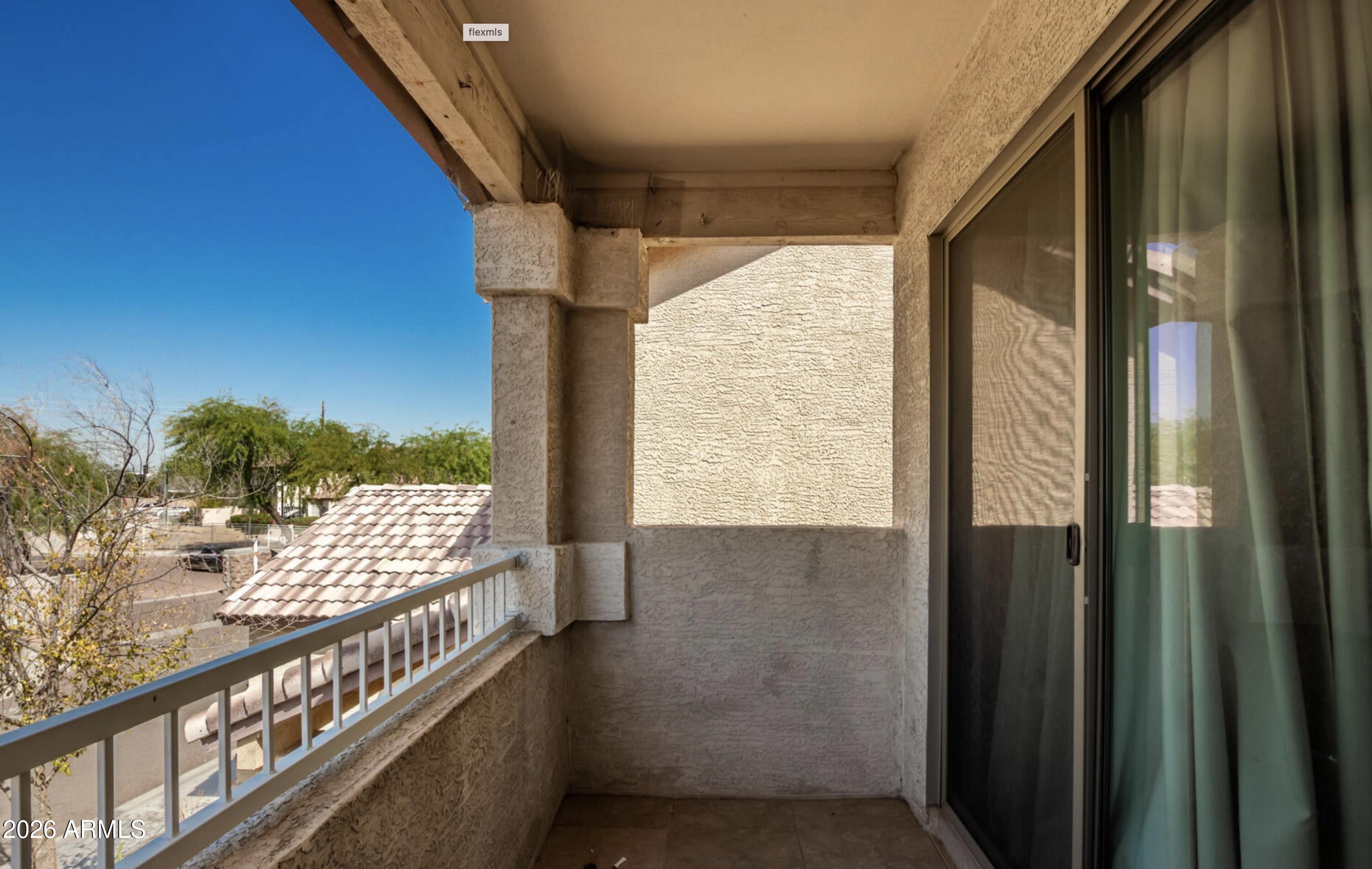 10225 West Camelback Road, Unit 12 Phoenix, AZ 85037 - Photo 15 of 19 a view of balcony with furniture