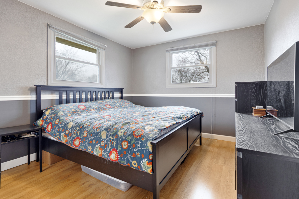 206 Yuma Lane Carol Stream, IL 60188 - Photo 11 of 26 a bed sitting in a room next to a window