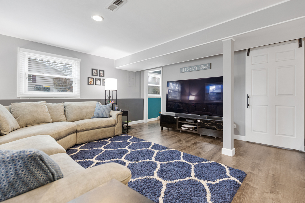 206 Yuma Lane Carol Stream, IL 60188 - Photo 16 of 26 a living room with furniture and a flat screen tv