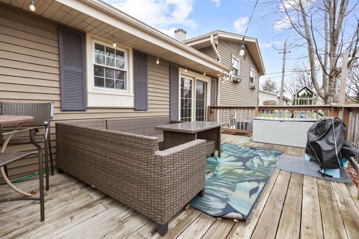 206 Yuma Lane Carol Stream, IL 60188 - Photo 21 of 26 a view of a roof deck with couches and wooden floor