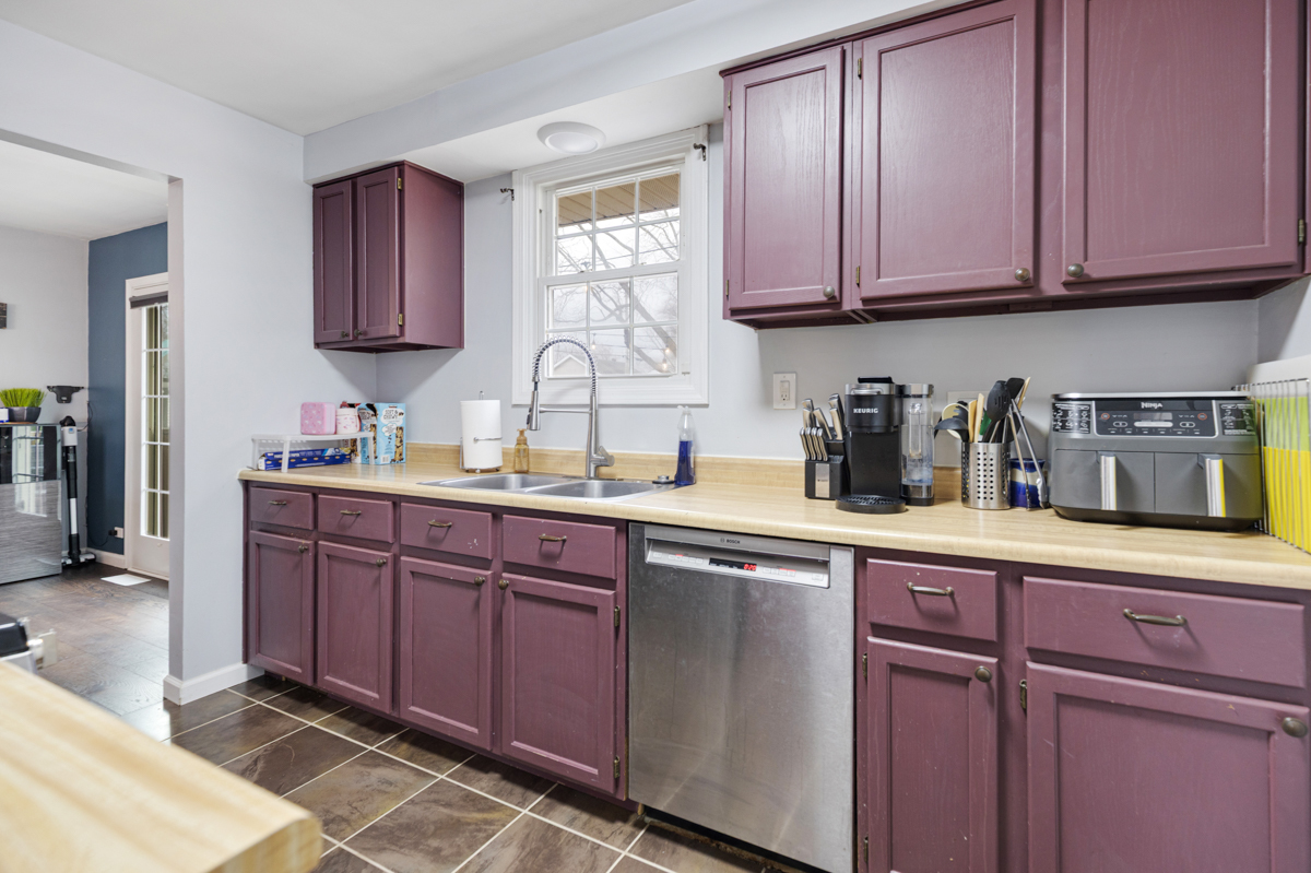 206 Yuma Lane Carol Stream, IL 60188 - Photo 10 of 26 a kitchen with stainless steel appliances granite countertop wooden cabinets a sink and dishwasher