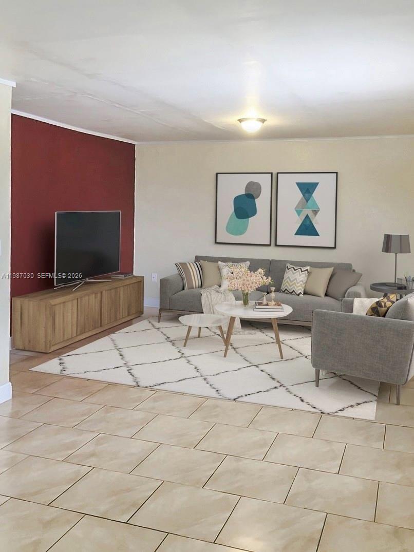 4250 Southwest 67th Avenue, Unit 32 Miami, FL 33155 - Photo 2 of 10 a living room with furniture and a flat screen tv