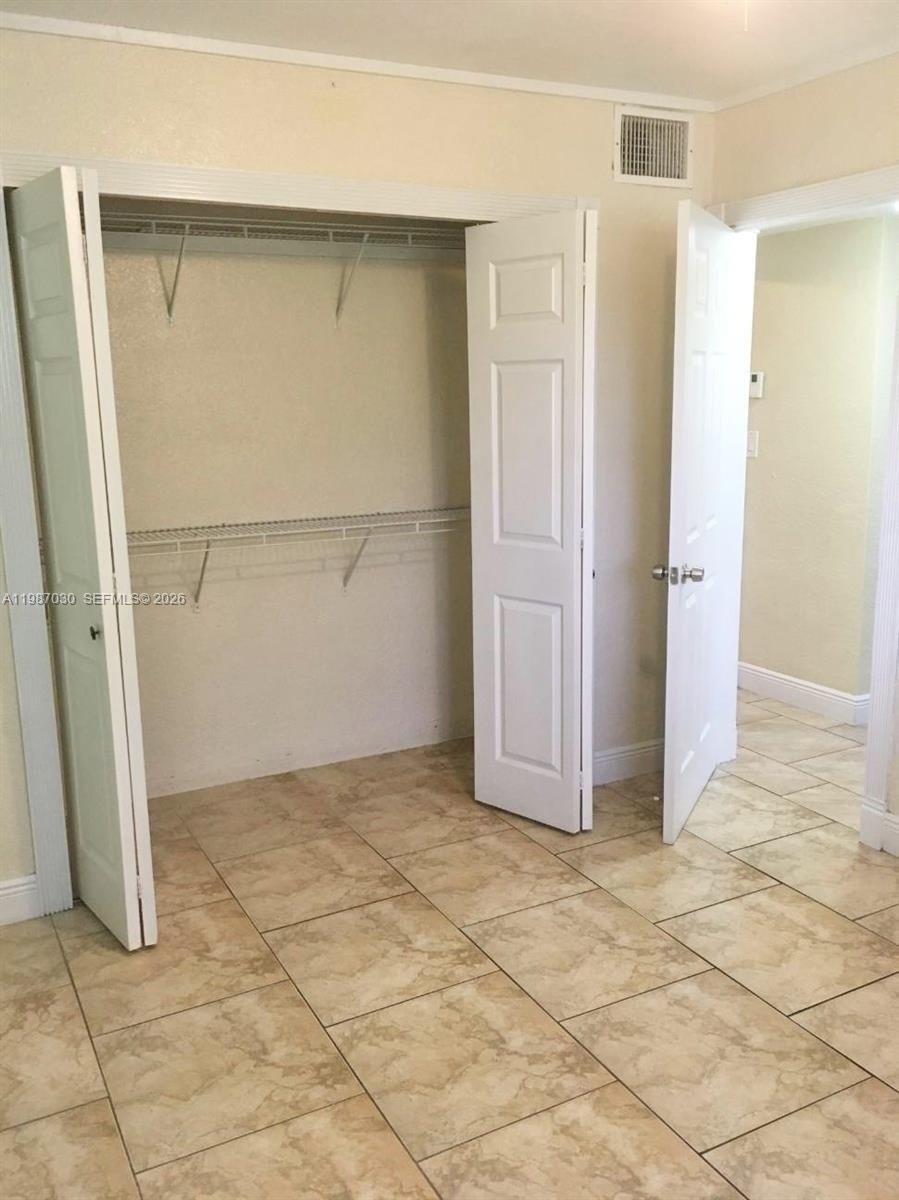 4250 Southwest 67th Avenue, Unit 32 Miami, FL 33155 - Photo 4 of 10 an empty room with entrance
