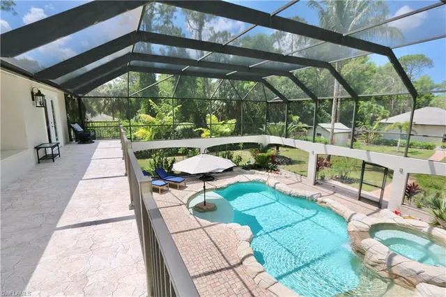 a view of a livingroom with furniture and chandelier