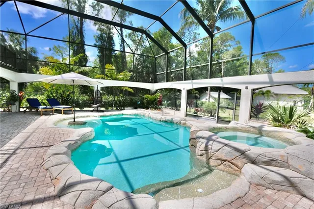 a view of a swimming pool with a patio