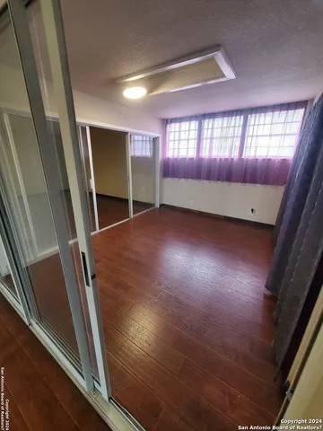 a view of an empty room and window