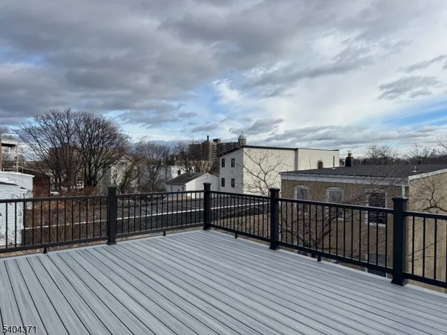 a bathroom with a double vanity sink toilet and shower