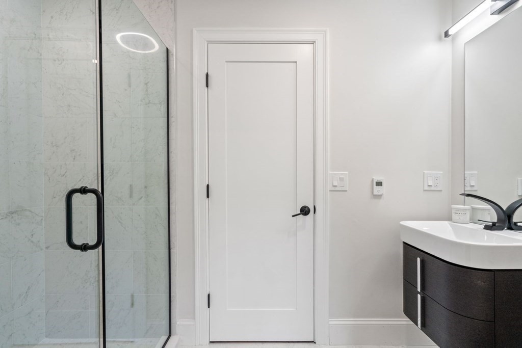 34 Donna Road Newton, MA 02459 - Photo 16 of 31 a bathroom with a sink and mirror