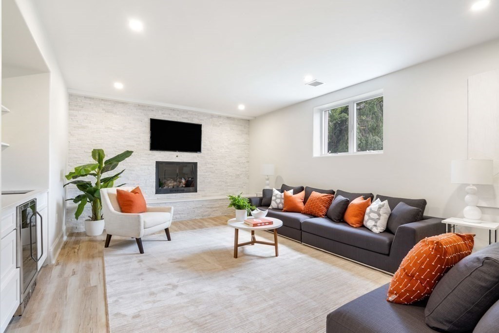 34 Donna Road Newton, MA 02459 - Photo 18 of 31 a living room with furniture and a flat screen tv