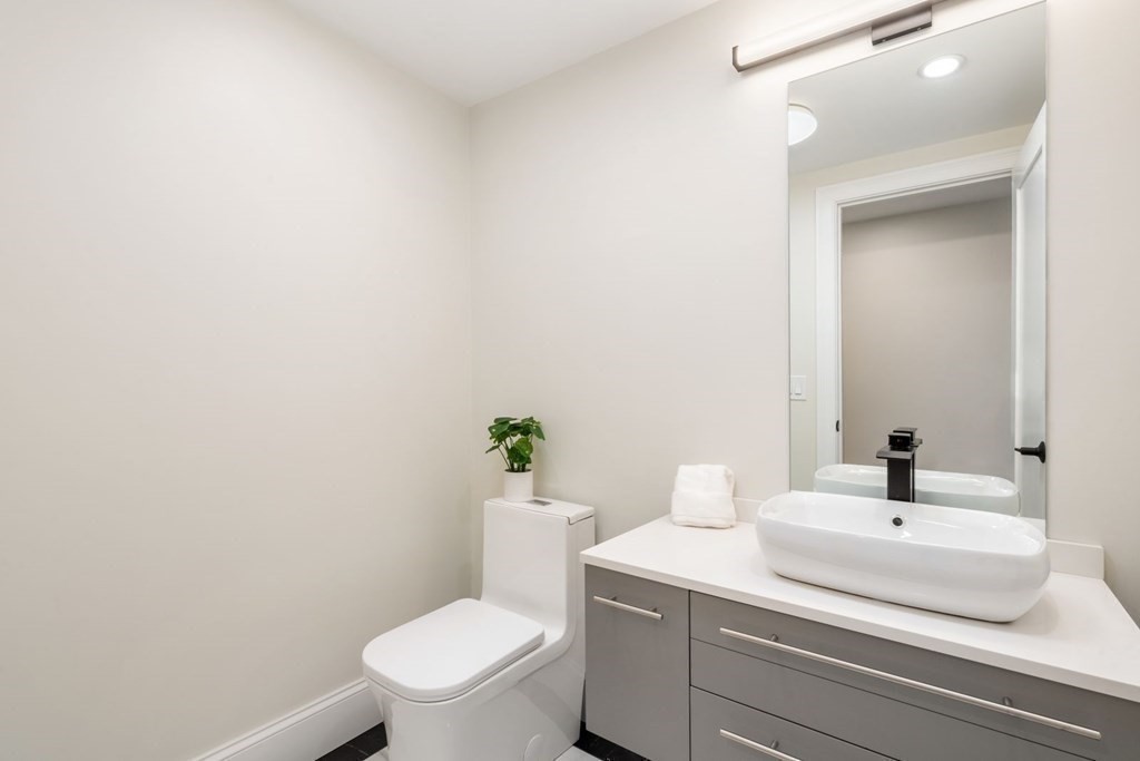 34 Donna Road Newton, MA 02459 - Photo 20 of 31 a bathroom with a sink a toilet and a mirror