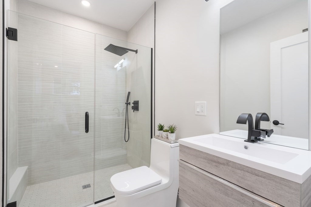 34 Donna Road Newton, MA 02459 - Photo 22 of 31 a bathroom with a sink a toilet and shower
