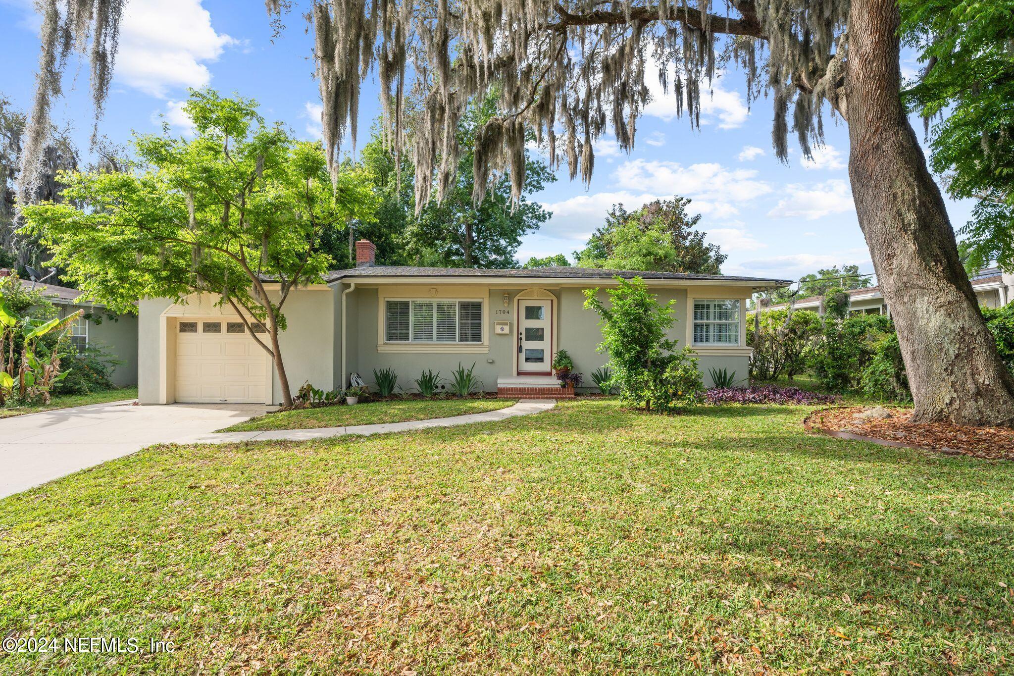 1704 Furman Road Jacksonville, FL 32217 - Photo 1 of 26 a front view of house with yard and trees