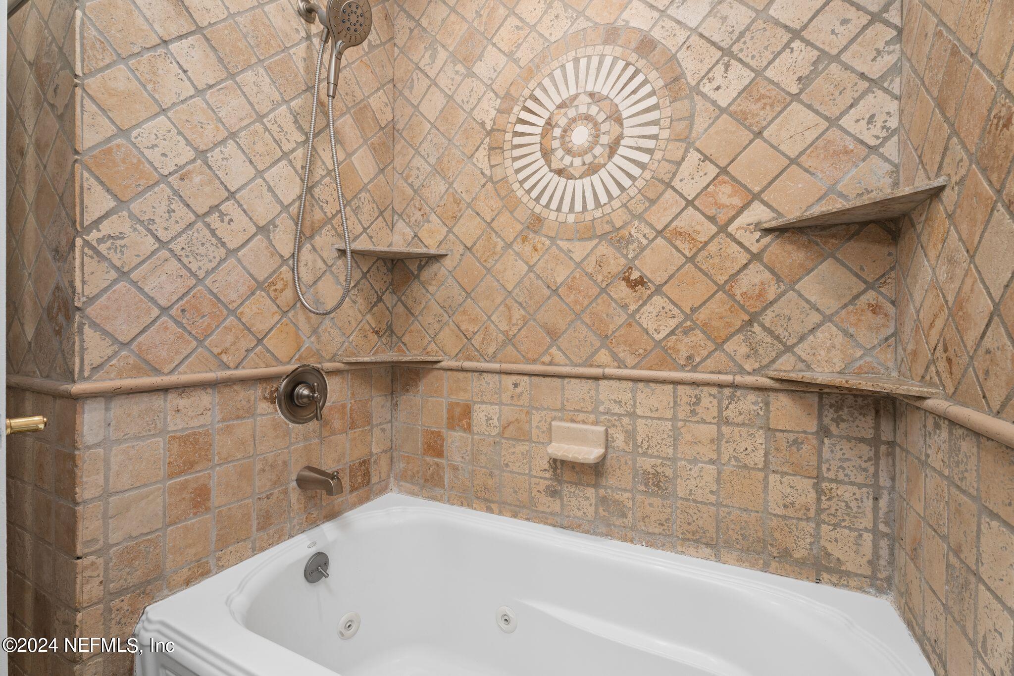 1704 Furman Road Jacksonville, FL 32217 - Photo 22 of 26 a bathroom with a bathtub and shower