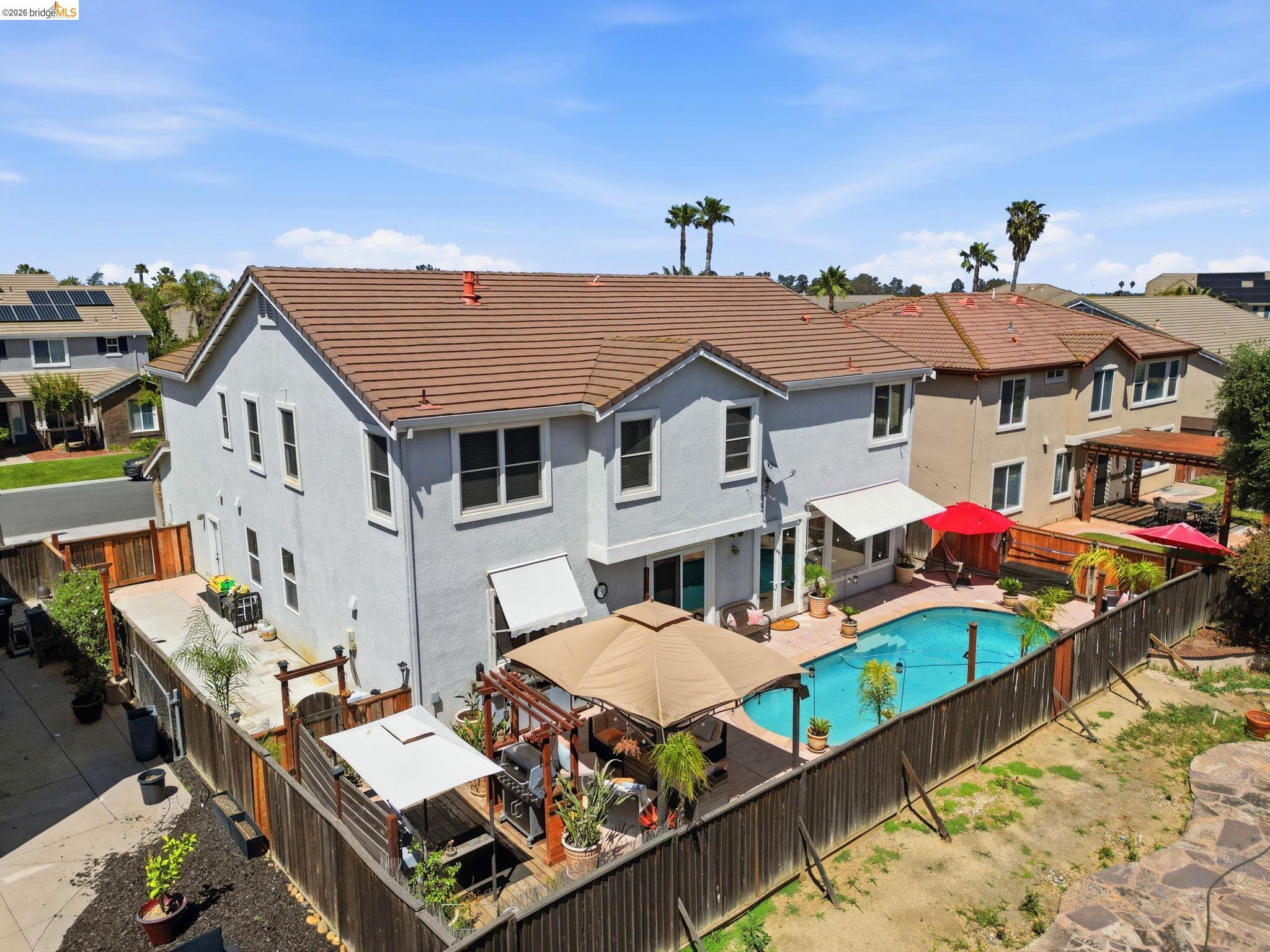 3438 Keystone Loop Discovery Bay, CA 94505 - Photo 54 of 57 a aerial view of a house with large trees and furniture