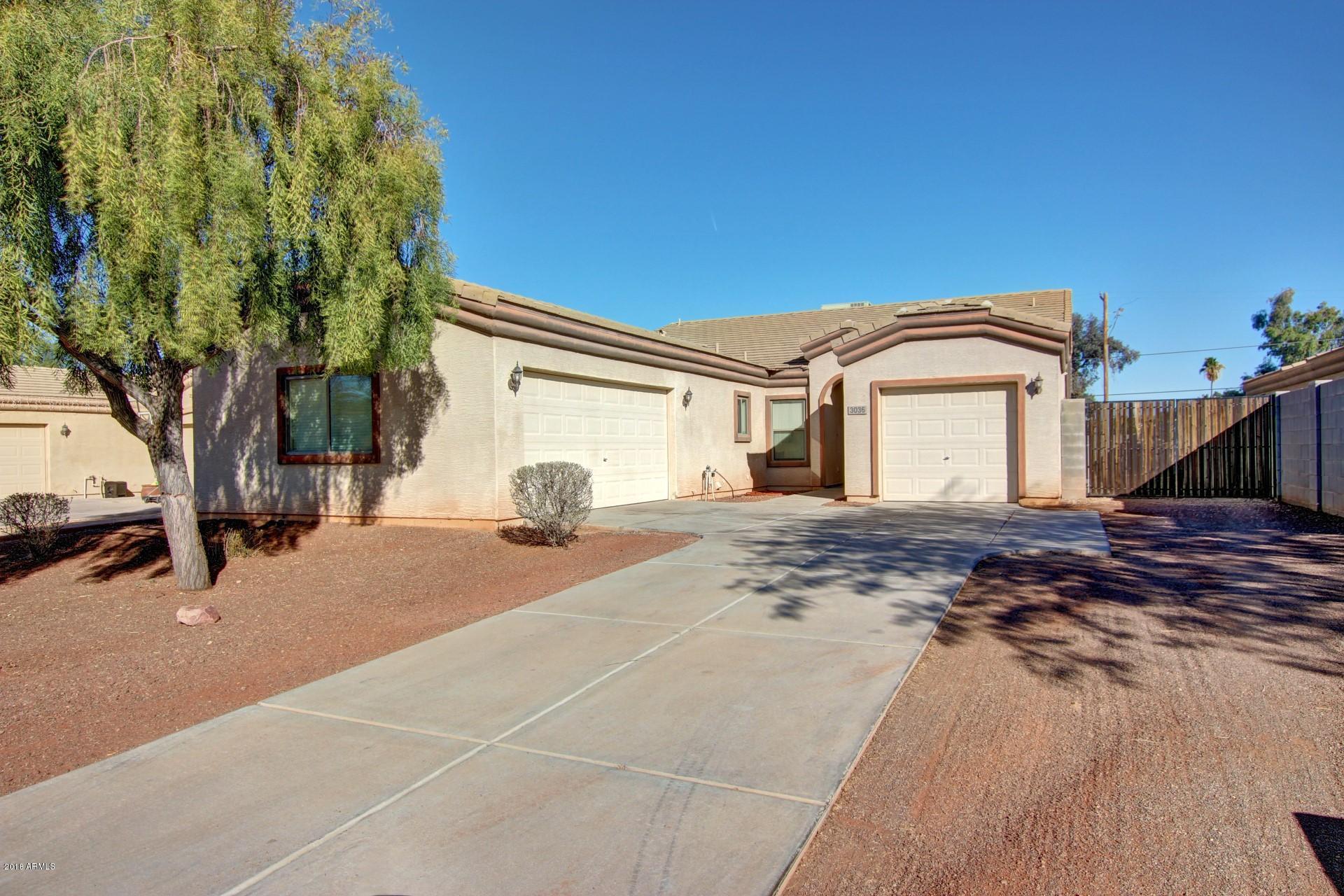 3036 East St John Road Phoenix, AZ 85032 - Photo 1 of 33 a front view of a house with a yard