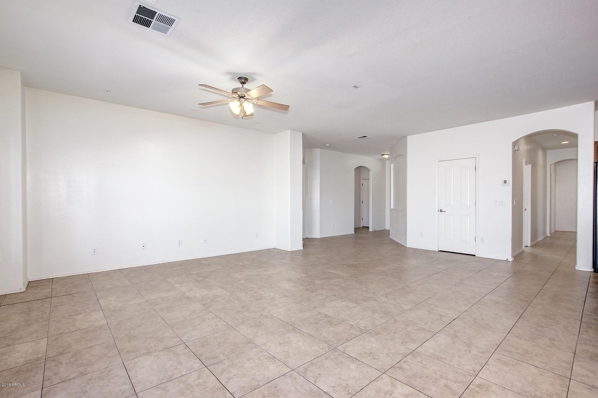 3036 East St John Road Phoenix, AZ 85032 - Photo 11 of 33 wooden floor in an empty room