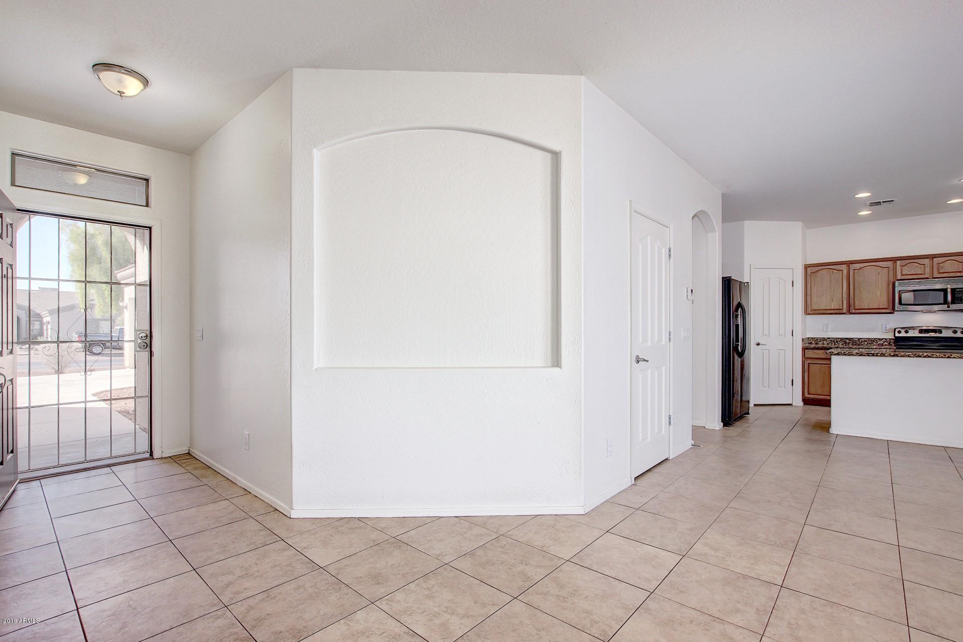 3036 East St John Road Phoenix, AZ 85032 - Photo 13 of 33 a view of a kitchen with microwave and refrigerator