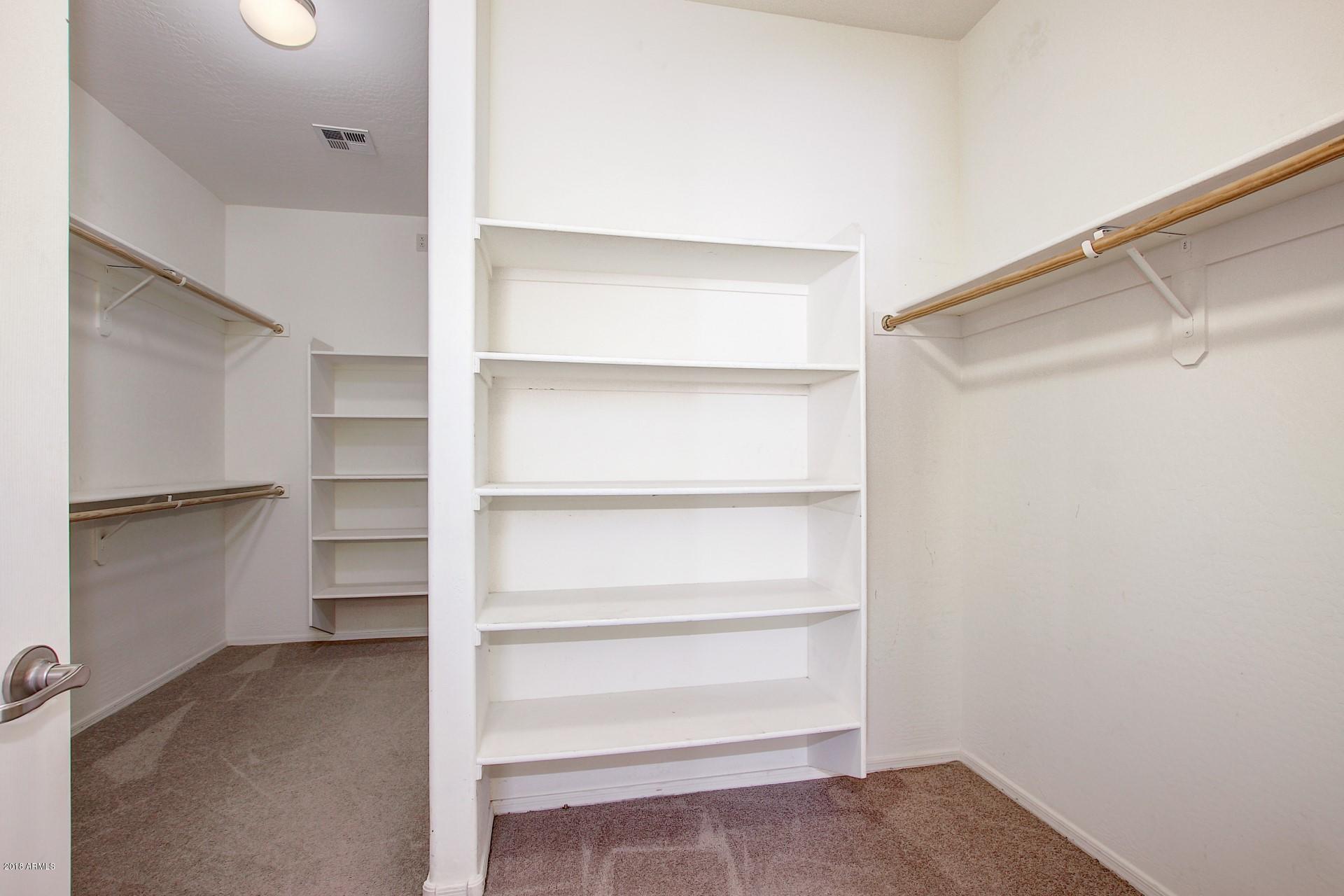3036 East St John Road Phoenix, AZ 85032 - Photo 21 of 33 a view of an empty walk in closet