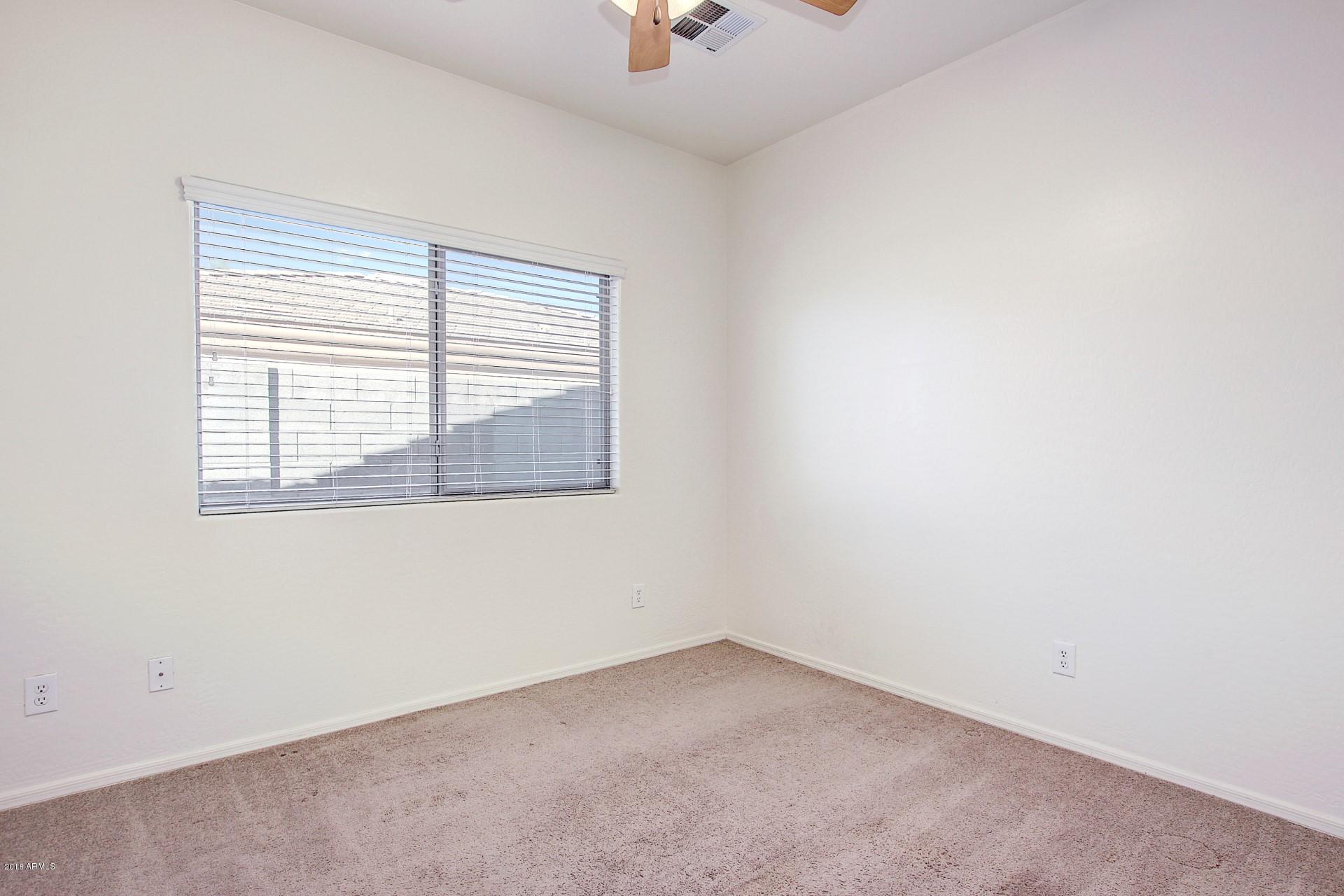 3036 East St John Road Phoenix, AZ 85032 - Photo 24 of 33 an empty room with a window
