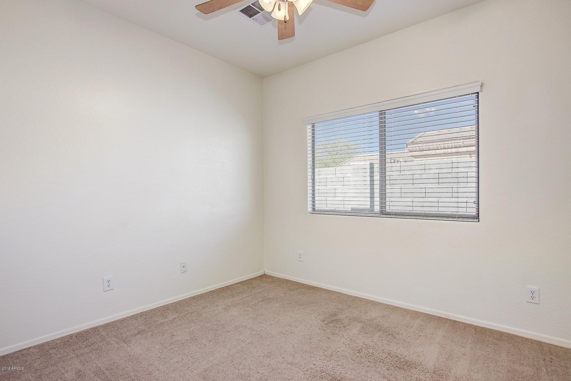 3036 East St John Road Phoenix, AZ 85032 - Photo 25 of 33 an empty room with a window