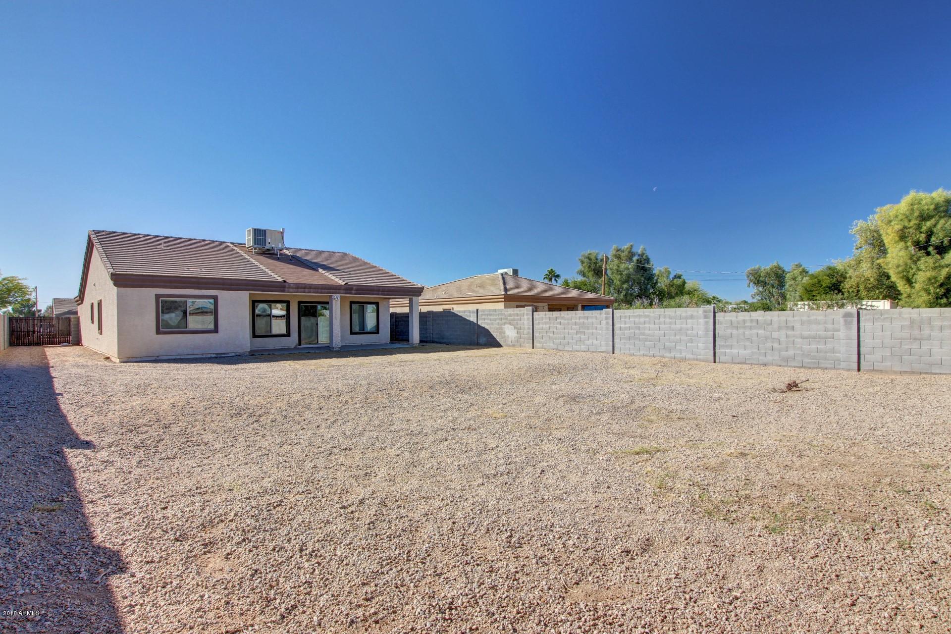 3036 East St John Road Phoenix, AZ 85032 - Photo 30 of 33 a house view with a backyard space