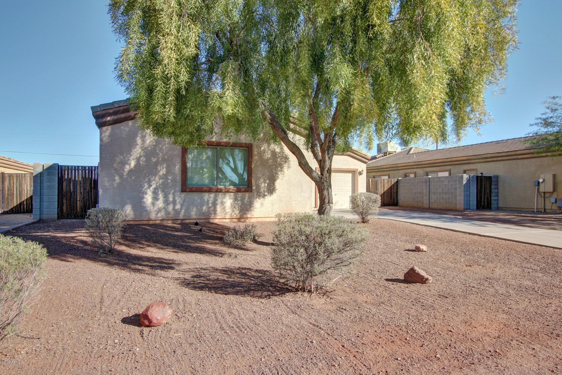 3036 East St John Road Phoenix, AZ 85032 - Photo 3 of 33 a front view of a house with garden