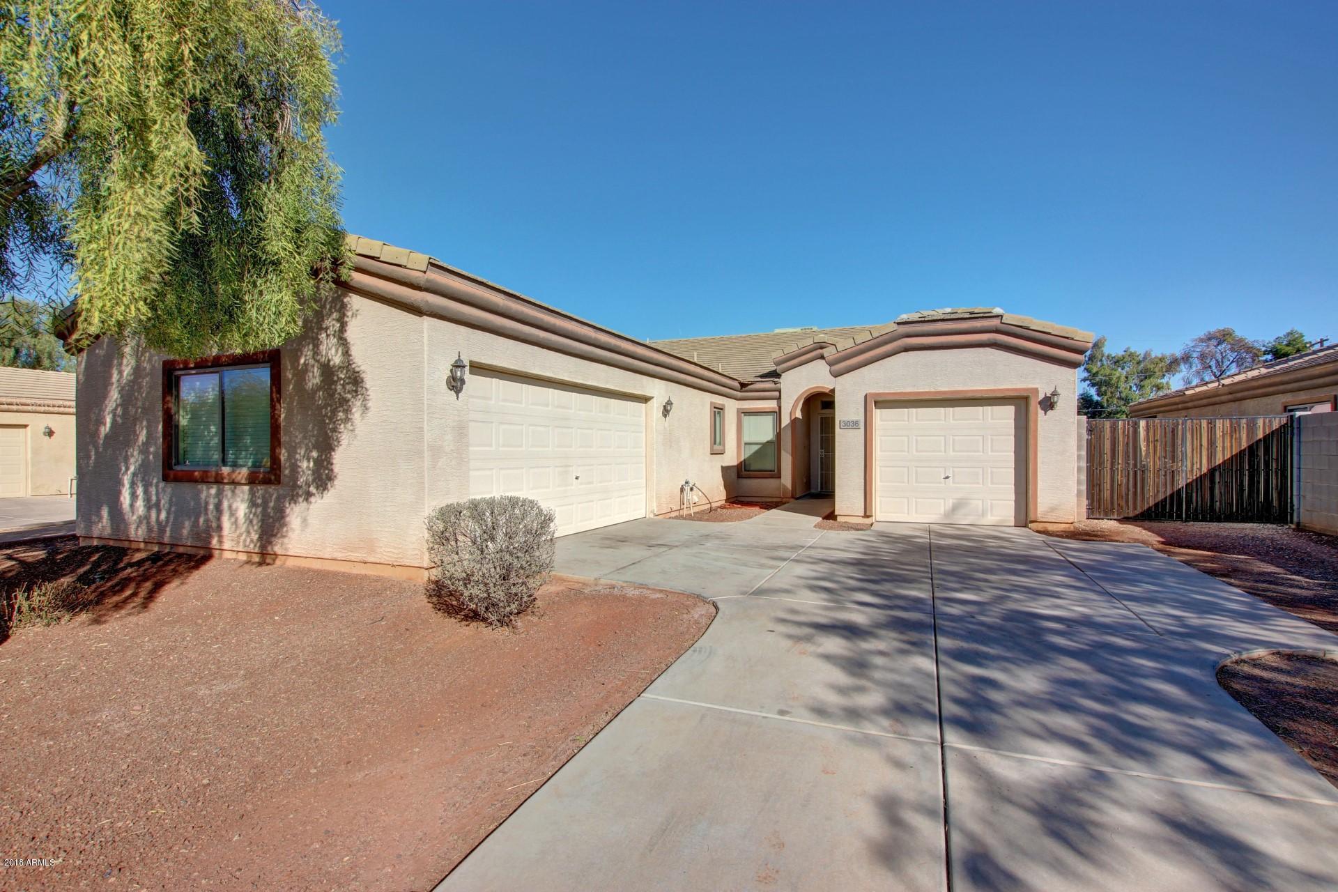 3036 East St John Road Phoenix, AZ 85032 - Photo 4 of 33 a view of a house with backyard and parking