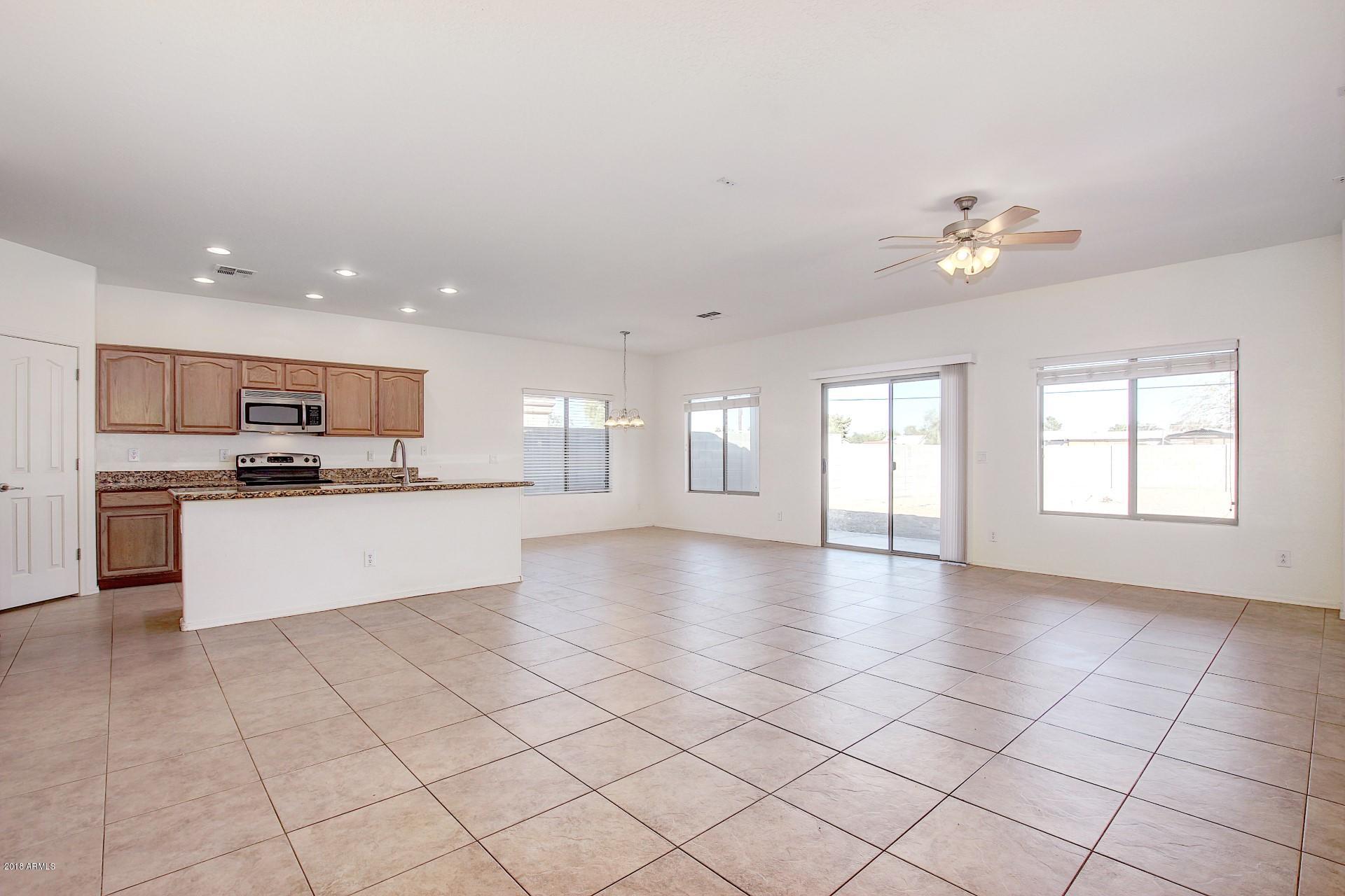 3036 East St John Road Phoenix, AZ 85032 - Photo 7 of 33 a view of kitchen with refrigerator and window