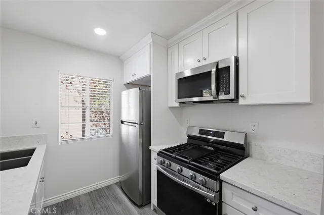 a kitchen with a sink and a window
