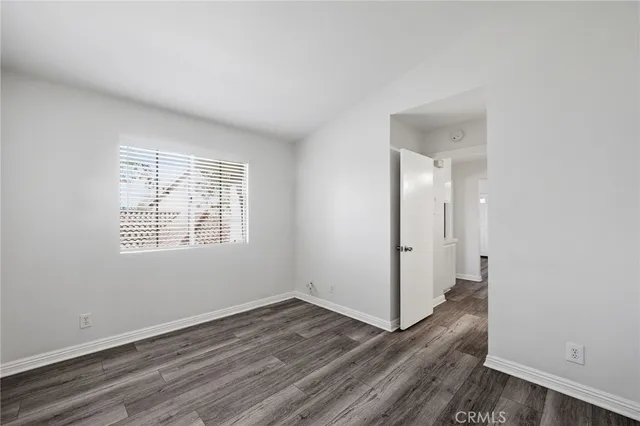 a view of room with wooden floor