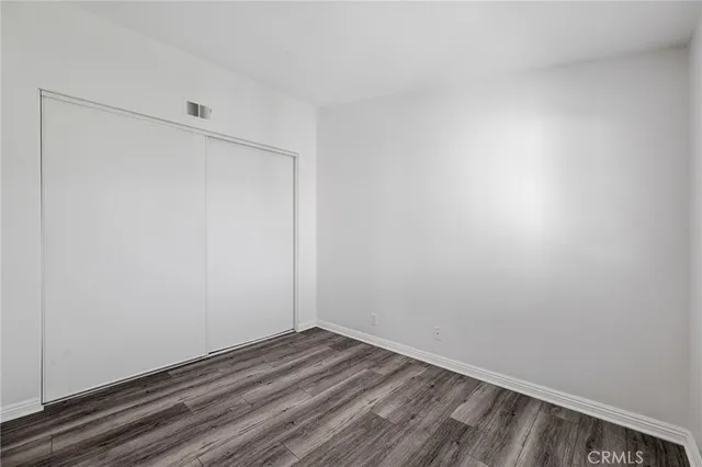 a swimming pool with outdoor seating and a yard