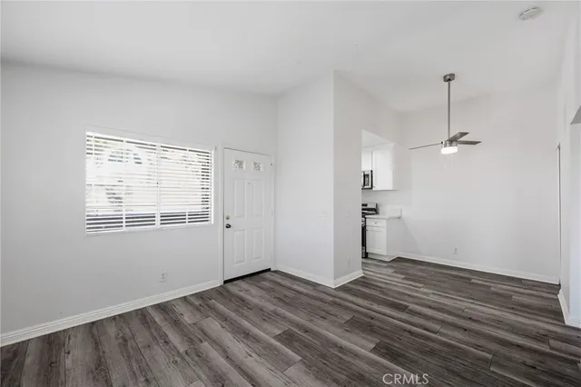 a view of a room with wooden floor