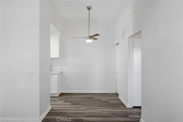 a kitchen with a stove a sink and a refrigerator