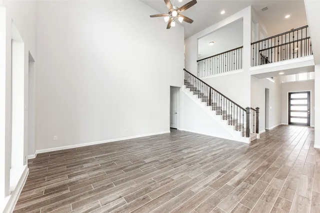a view of an entryway with wooden floor