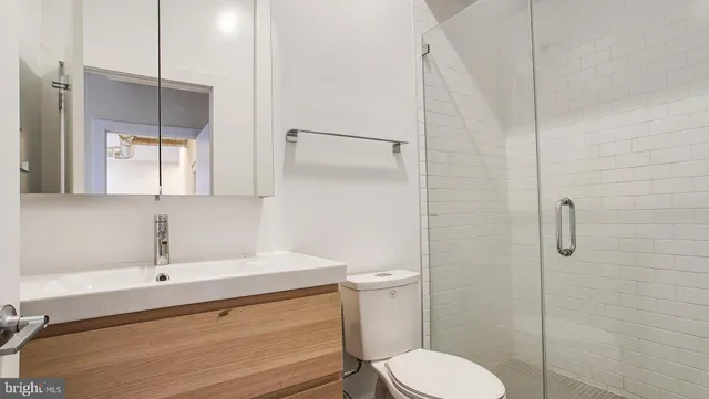 a kitchen with stainless steel appliances a stove refrigerator sink and microwave