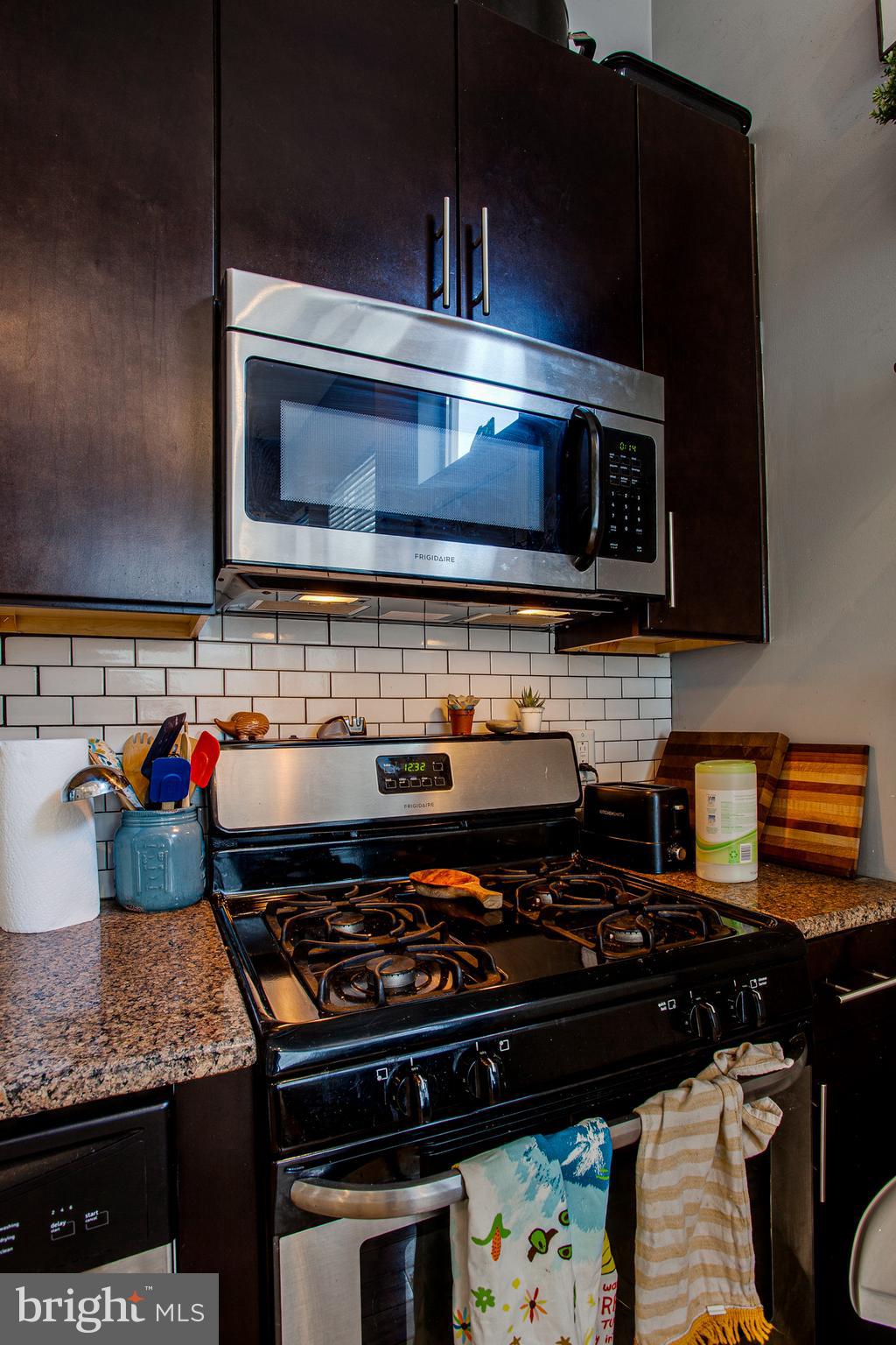1234 North 30th Street Philadelphia, PA 19121 - Photo 30 of 59 a stove top oven sitting inside of a kitchen