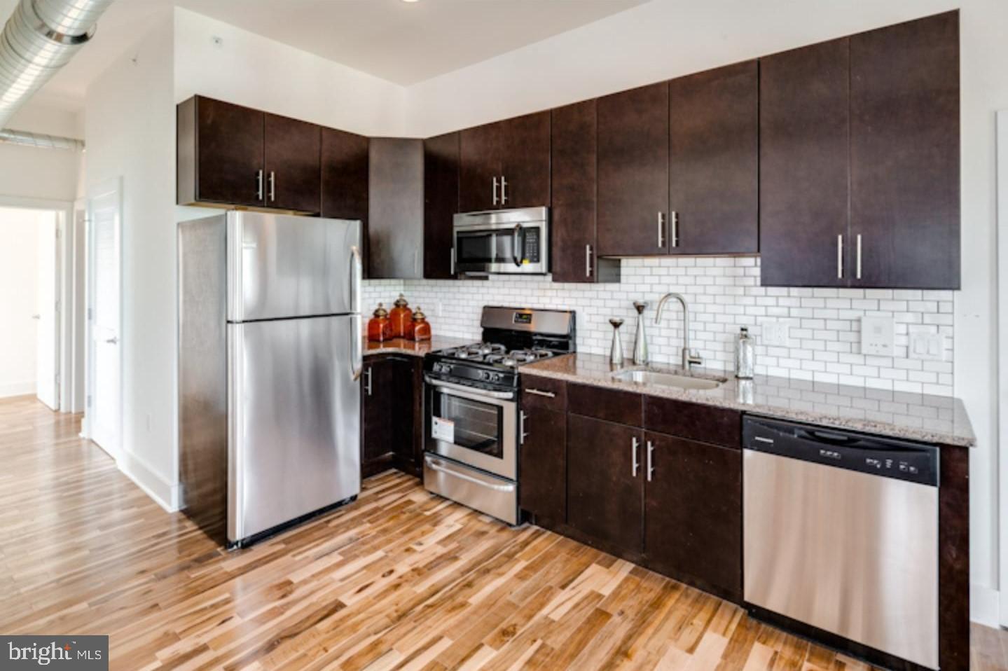 1234 North 30th Street Philadelphia, PA 19121 - Photo 3 of 59 a kitchen with a refrigerator sink and microwave