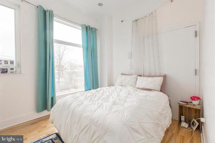 1234 North 30th Street Philadelphia, PA 19121 - Photo 37 of 59 a bedroom with a bed and a window