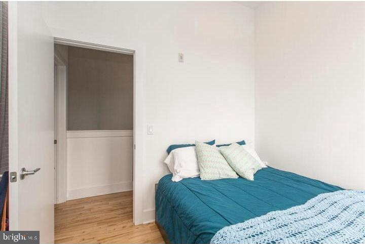 1234 North 30th Street Philadelphia, PA 19121 - Photo 39 of 59 a bedroom with a bed and a night stand