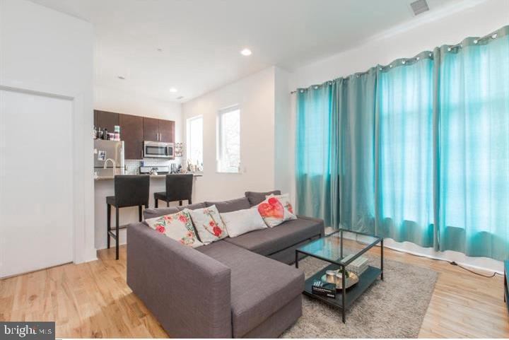 1234 North 30th Street Philadelphia, PA 19121 - Photo 41 of 59 a living room with furniture and a window