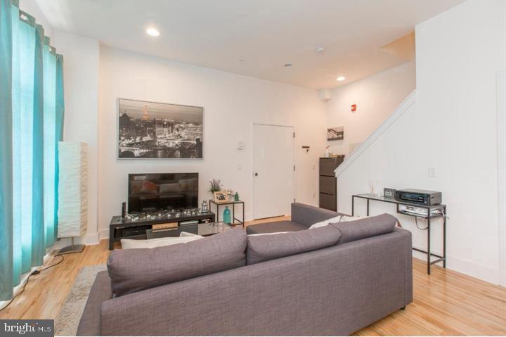 1234 North 30th Street Philadelphia, PA 19121 - Photo 45 of 59 a living room with furniture and a flat screen tv