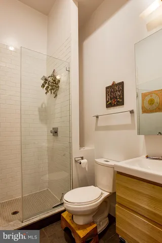 a front view of a residential apartment building with a yard