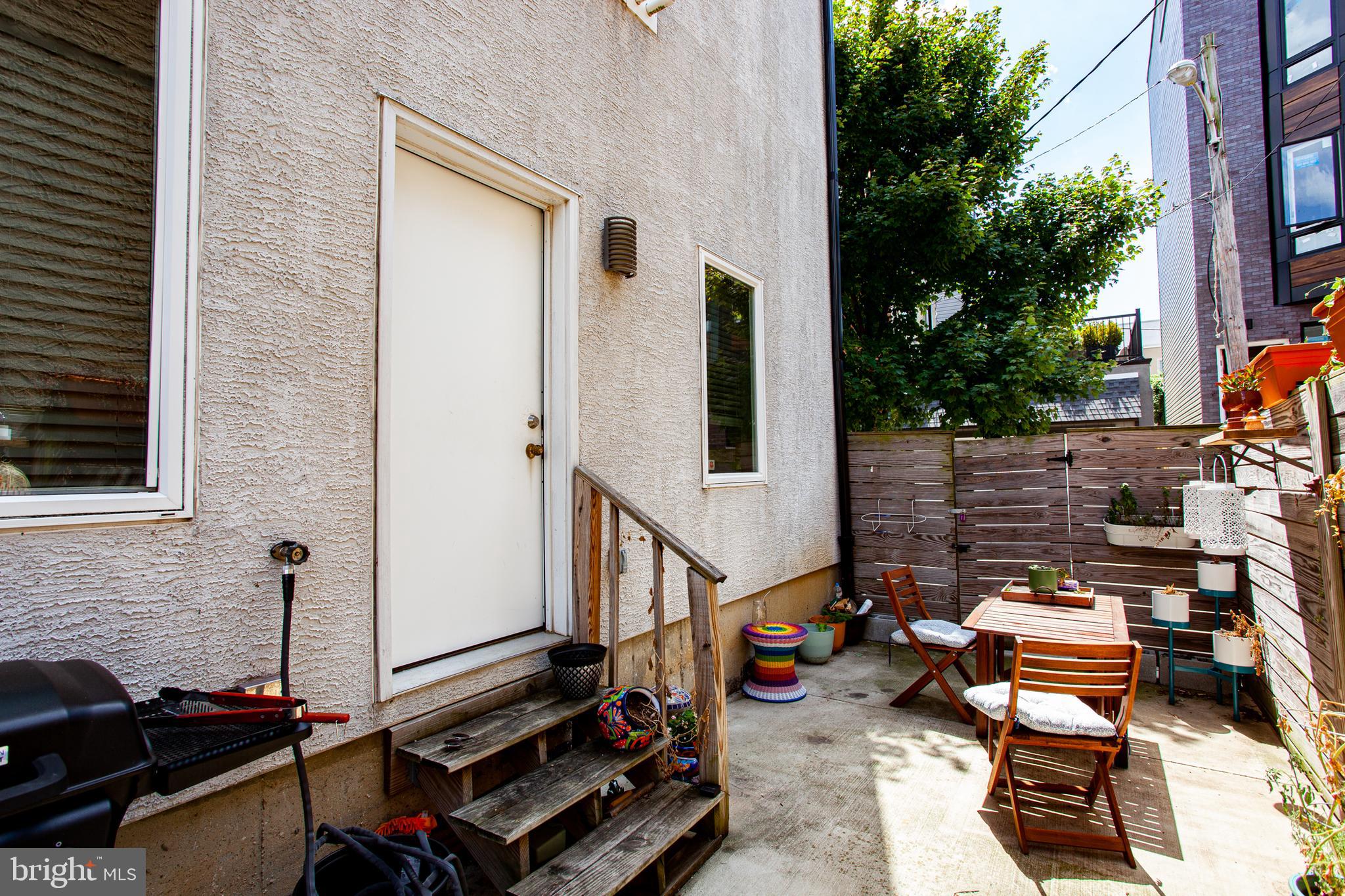 1234 North 30th Street Philadelphia, PA 19121 - Photo 53 of 59 a backyard of a house with outdoor seating