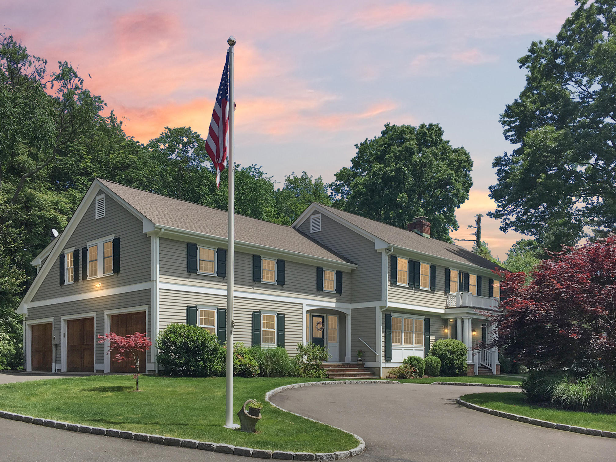 390 Middlesex Road Darien, CT 06820 - Photo 1 of 24 a front view of a house with a garden and plants
