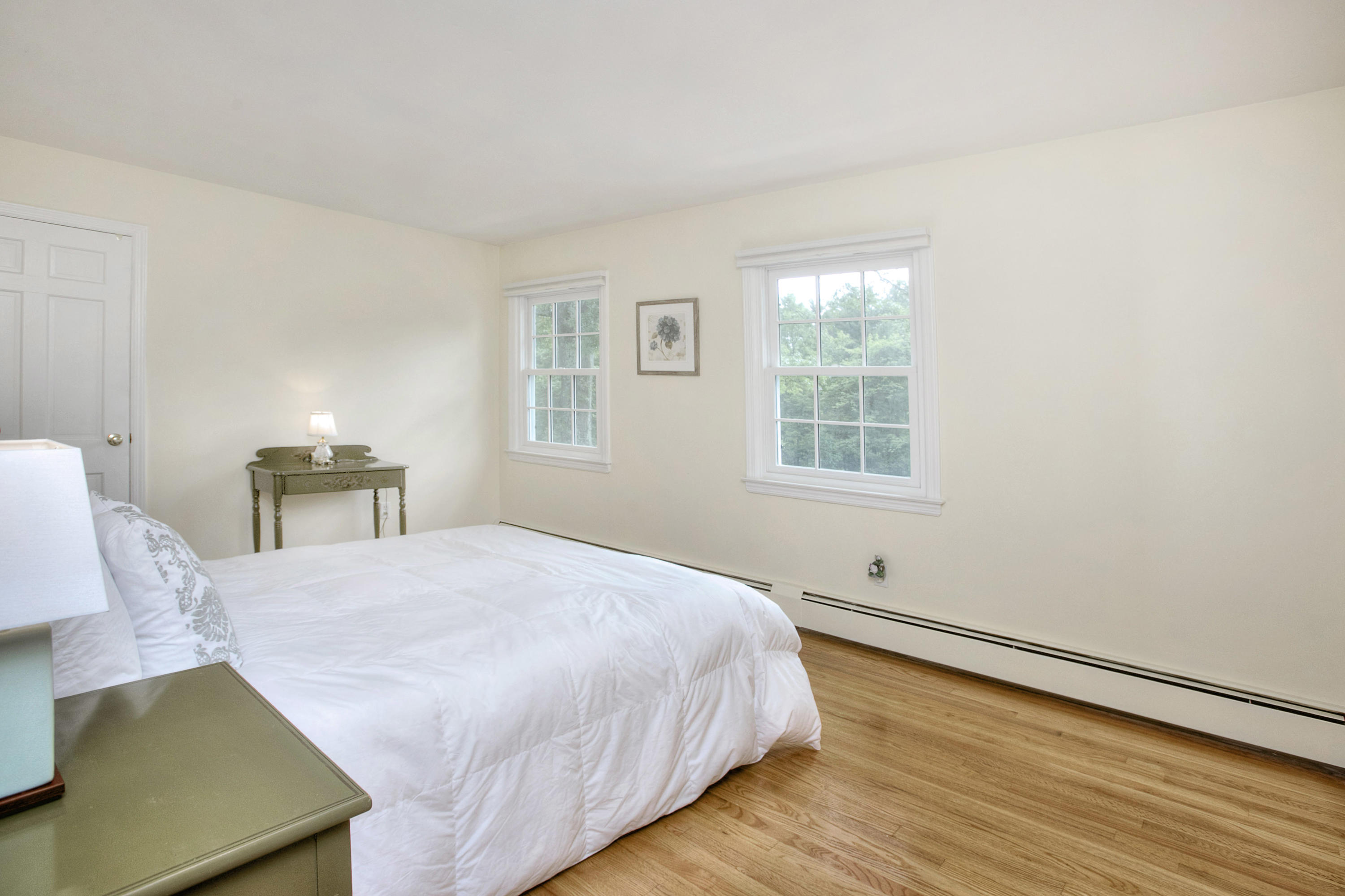 390 Middlesex Road Darien, CT 06820 - Photo 16 of 24 a bedroom with a bed and a window