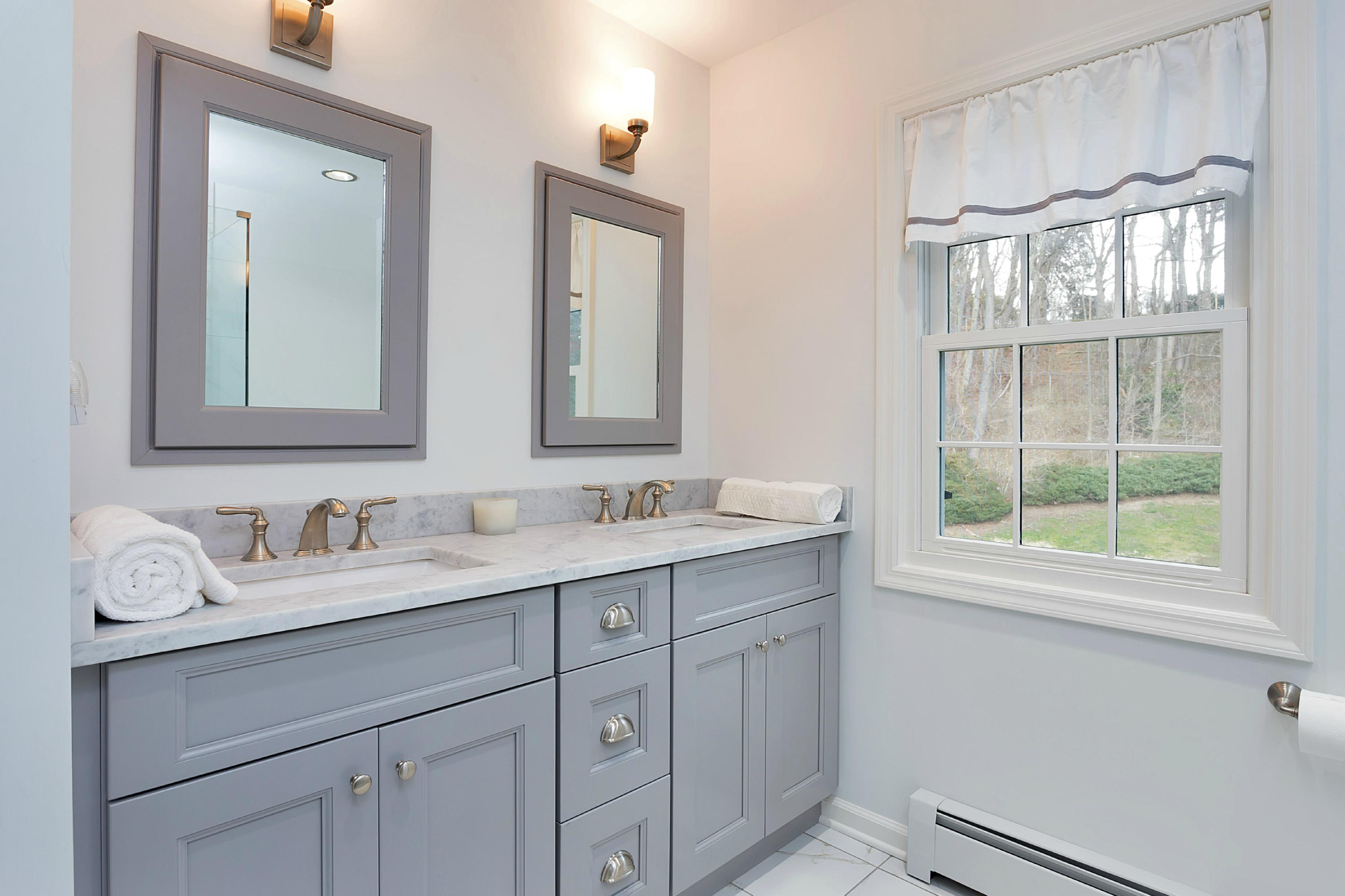 390 Middlesex Road Darien, CT 06820 - Photo 17 of 24 a bathroom with double sink and a mirror