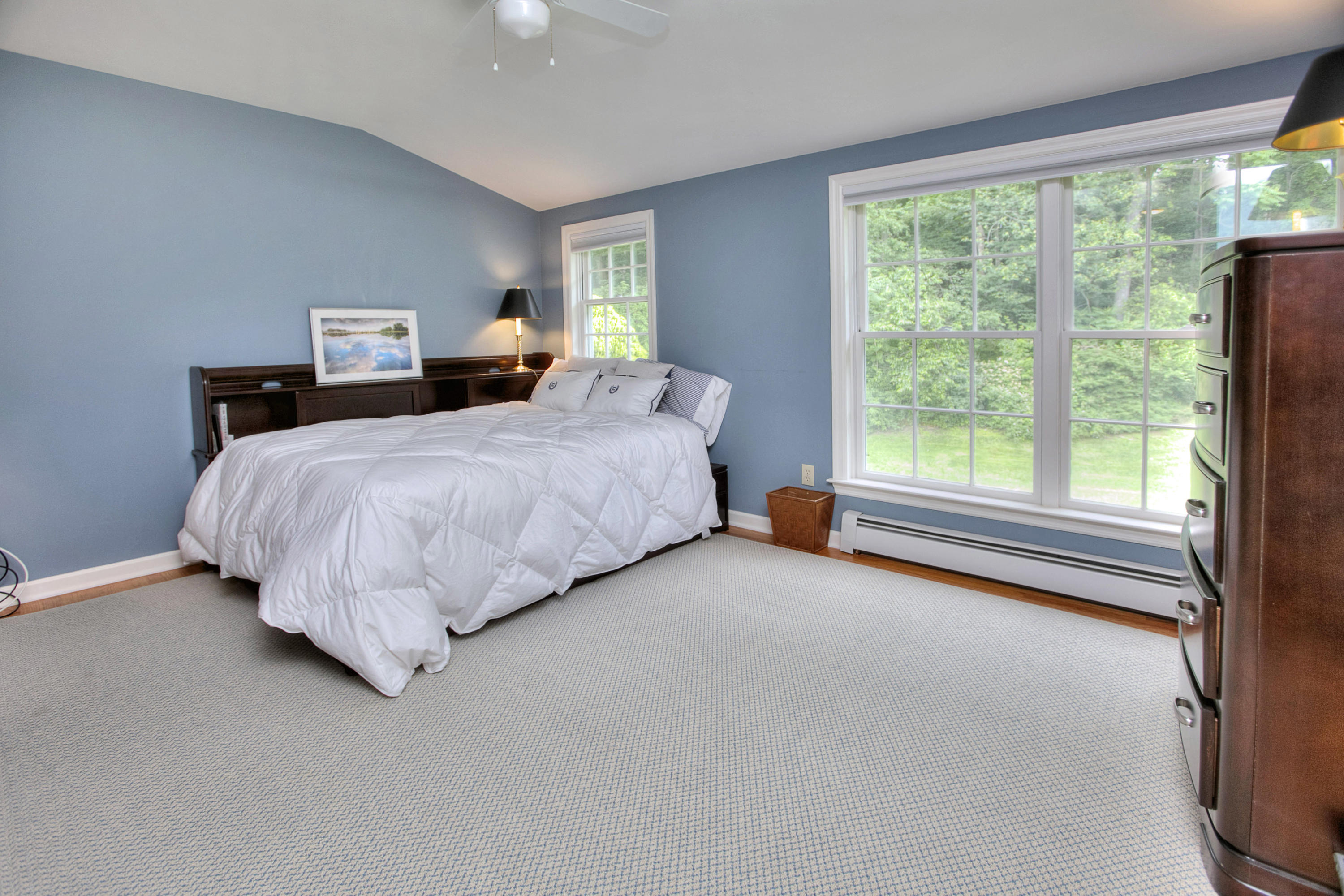 390 Middlesex Road Darien, CT 06820 - Photo 19 of 24 a bedroom with a bed and a large window