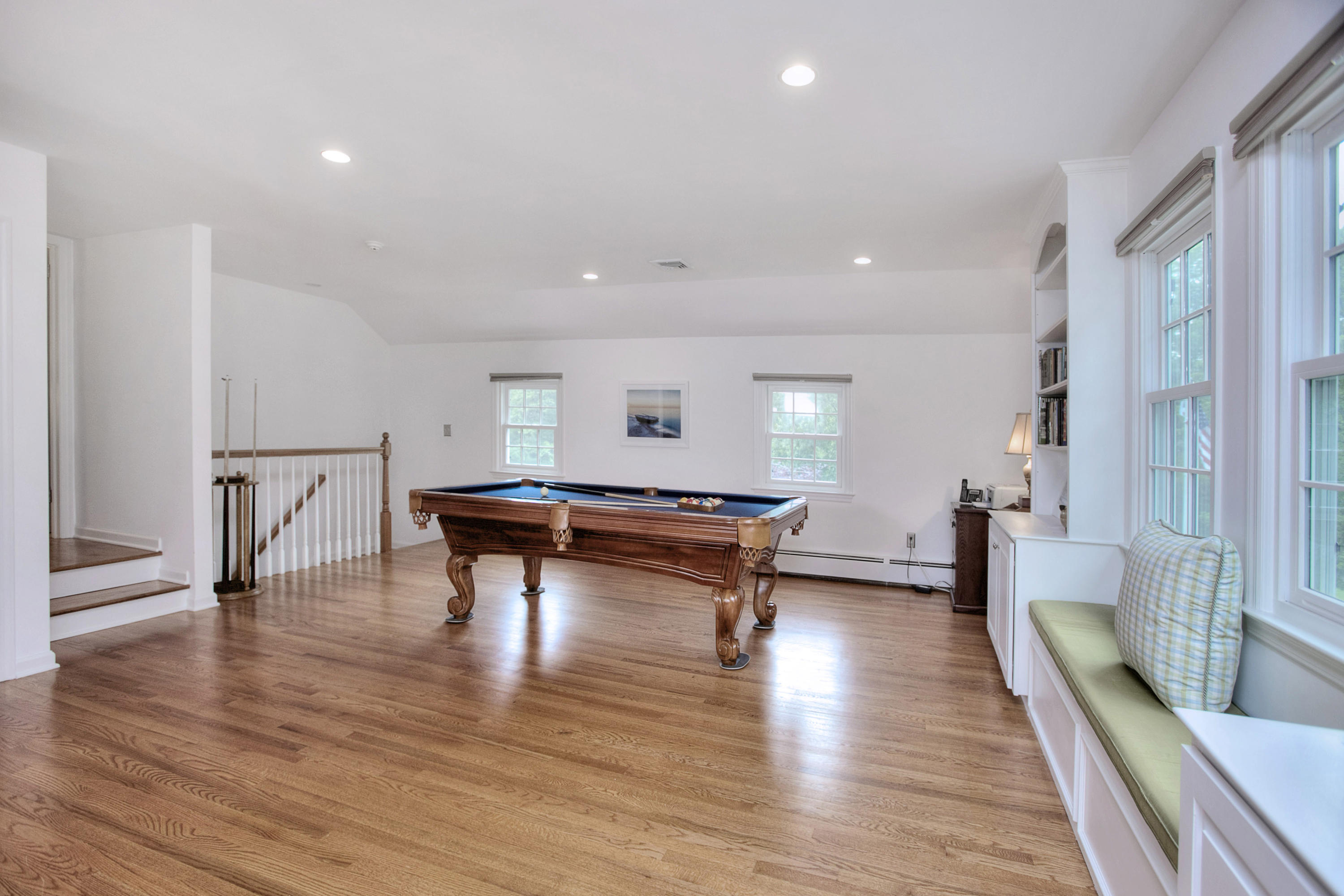 390 Middlesex Road Darien, CT 06820 - Photo 21 of 24 a room with wooden floor table tennis and table