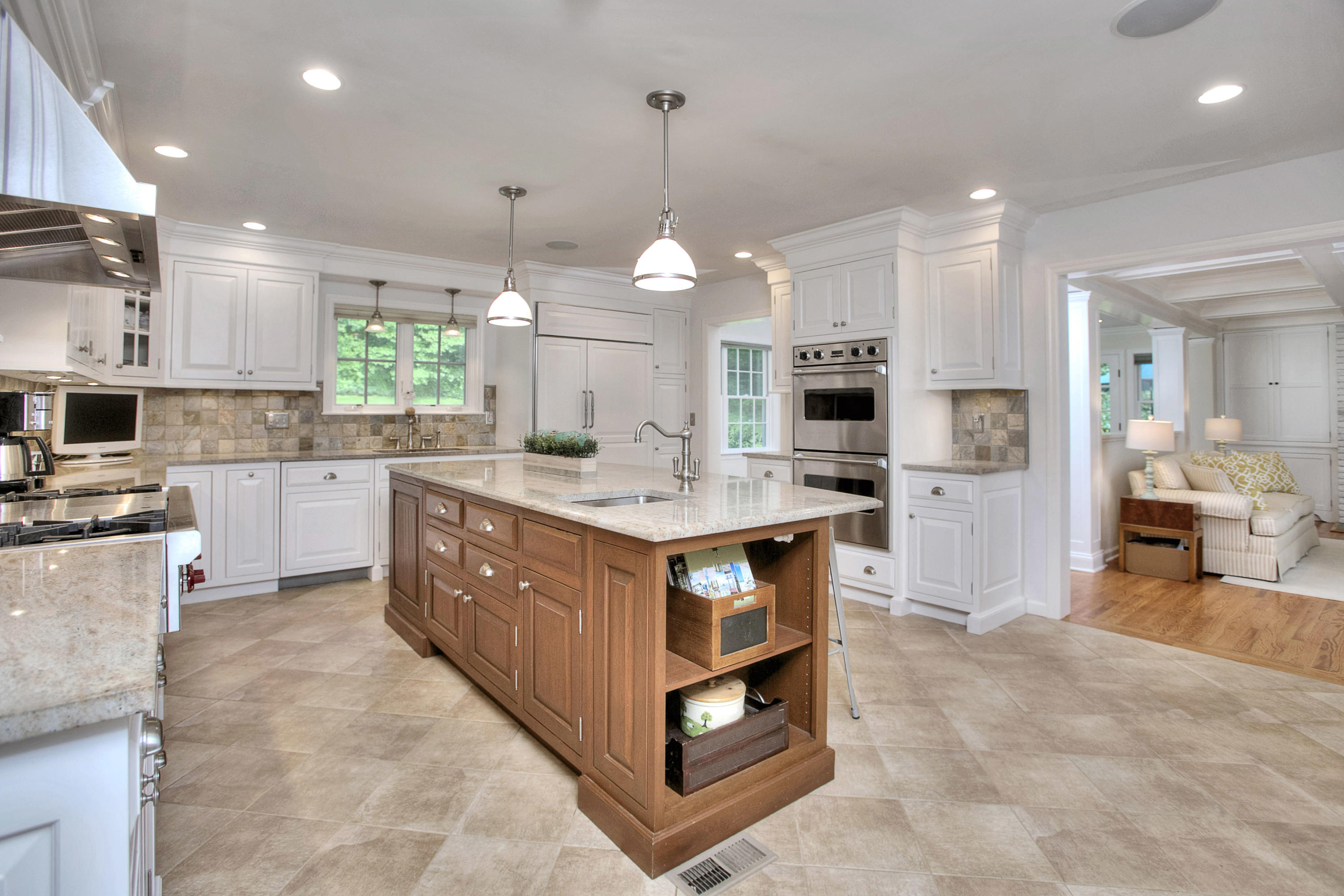 390 Middlesex Road Darien, CT 06820 - Photo 7 of 24 a kitchen with kitchen island granite countertop a sink counter top space appliances and a center island